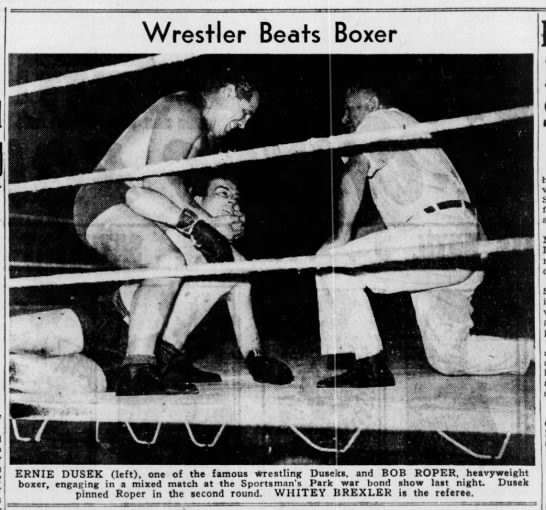 Ernie Dusek works over boxer Bob Roper at a war bond drive benefit in St. Louis-1943. Referee Whitey Brexler attentively waits for Roper to cry enough. Ernie Dusek works over boxer Bob Roper at a war bond drive benefit in St. Louis-1943. Referee Whitey Brexler attentively waits for Roper to cry enough.