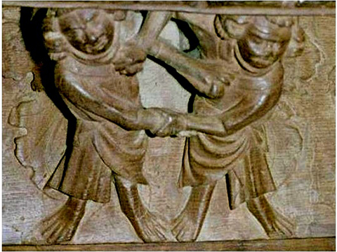 Misericord SB04 at Ely Cathedral, 16th Century
Two men, wearing long loose gowns, wrestling Misericord SB04 at Ely Cathedral, 16th Century
Two men, wearing long loose gowns, wrestling